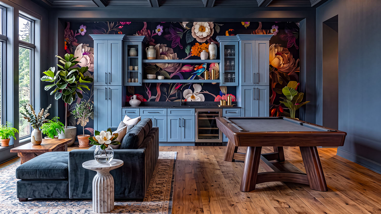 Game room with a built-in wet bar in slate blue cabinetry, pool table, and floral wallpaper accent wall